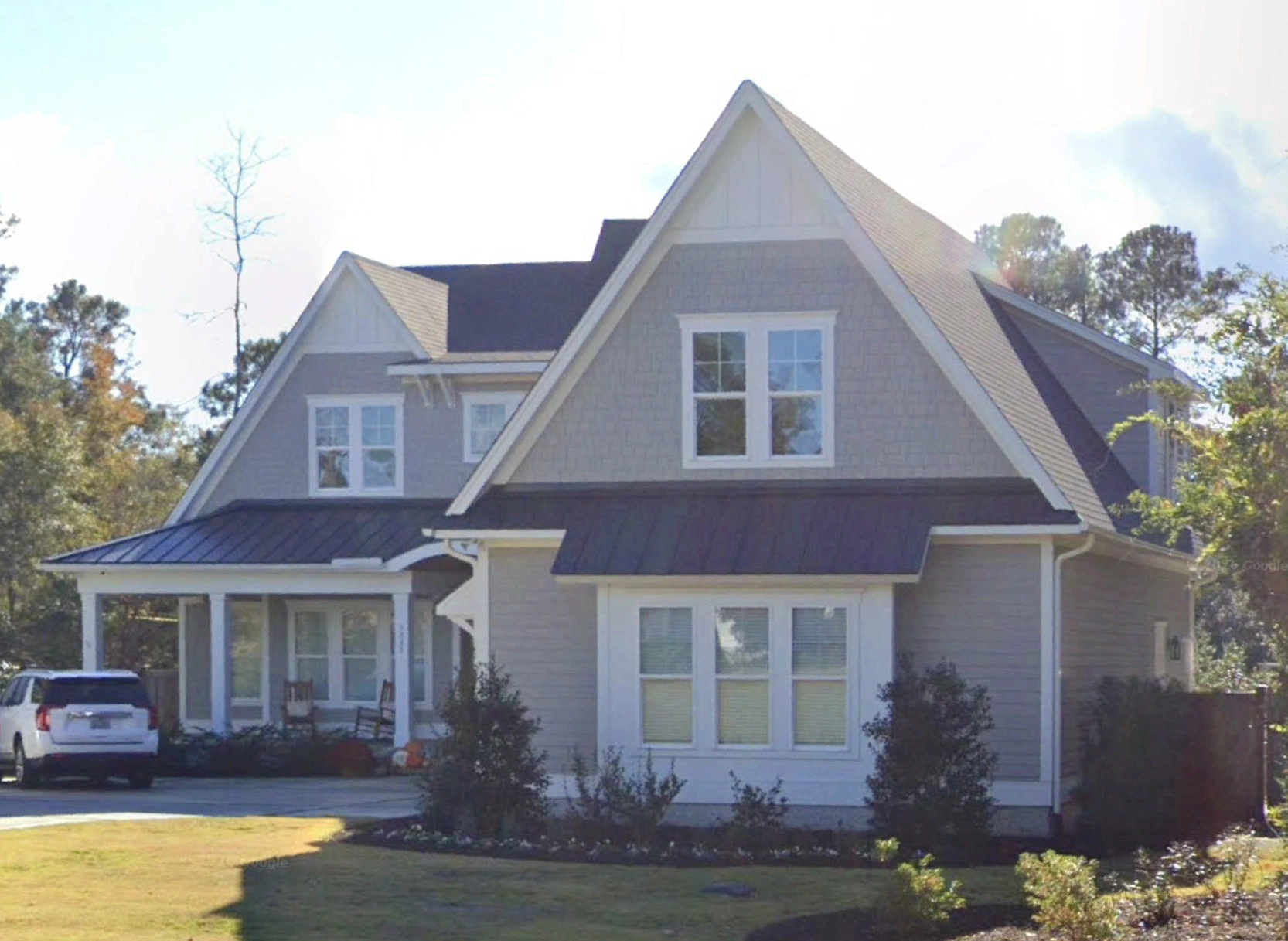 1.5-Story House Plan 4176 ft²: 4 Beds, Home Office, 4.5 Baths, Open Floor Plan, 3-Car Garage