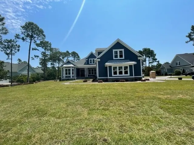 1.5-Story House Plan 4196 ft²: 5 Beds, Home Office, 5 Baths, Open Floor Plan, 3-Car Garage