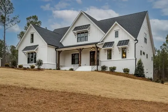 1.5-Story House Plan 4160 ft²: 4 Beds, Home Office, 4.5 Baths, Open Floor Plan, 3-Car Garage