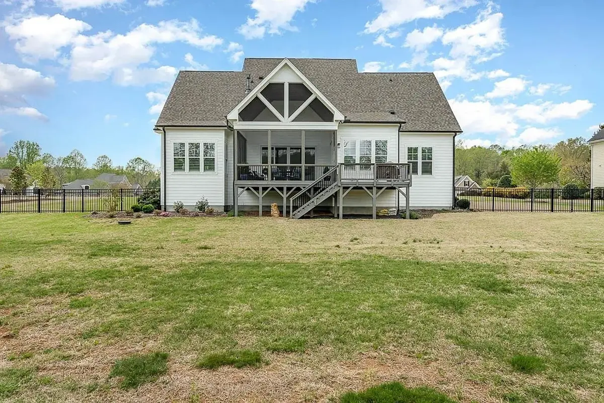 1.5-Story House Plan 4143 ft²: 4 Beds, Home Office, 4.5 Baths, Open Floor Plan, 3-Car Garage