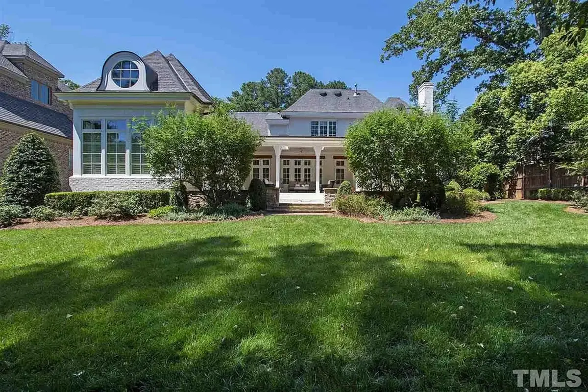 1.5-Story House Plan 5180 ft²: 4 Beds, Home Office, 4.5 Baths, Open Floor Plan, 2-Car Garage