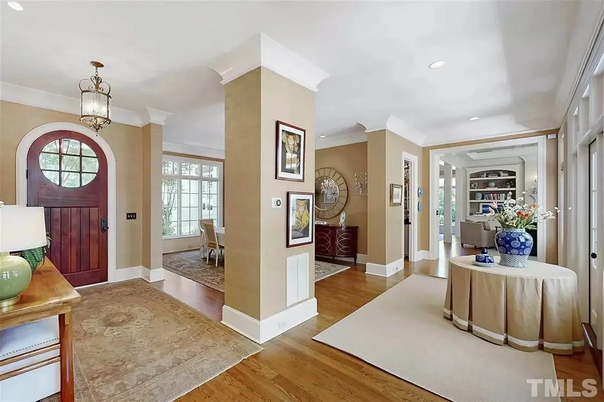 1.5-Story House Plan 5180 ft²: 4 Beds, Home Office, 4.5 Baths, Open Floor Plan, 2-Car Garage